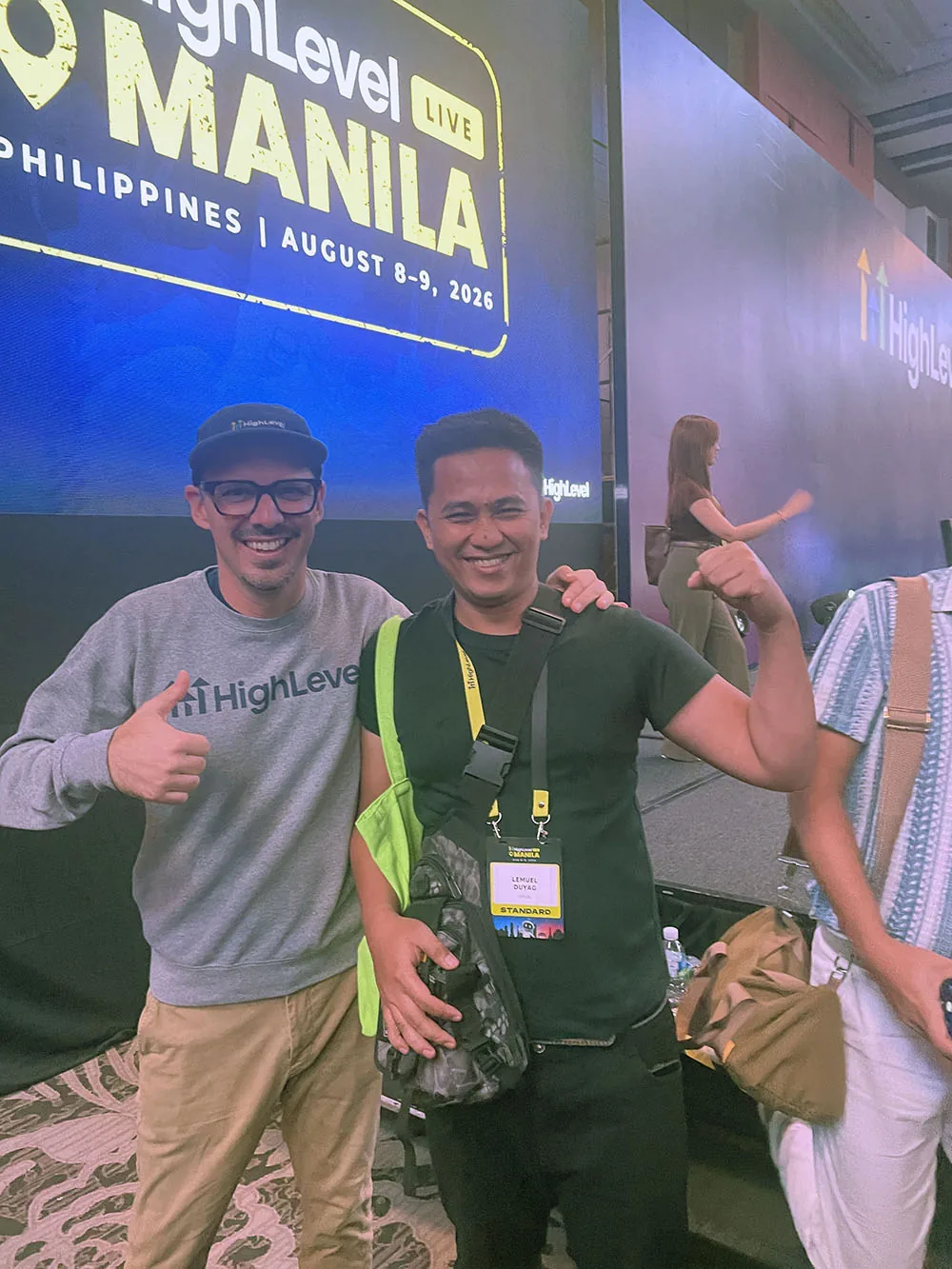 Lemuel Duyag with a HighLevel team member in front of the HighLevel LIVE Manila stage